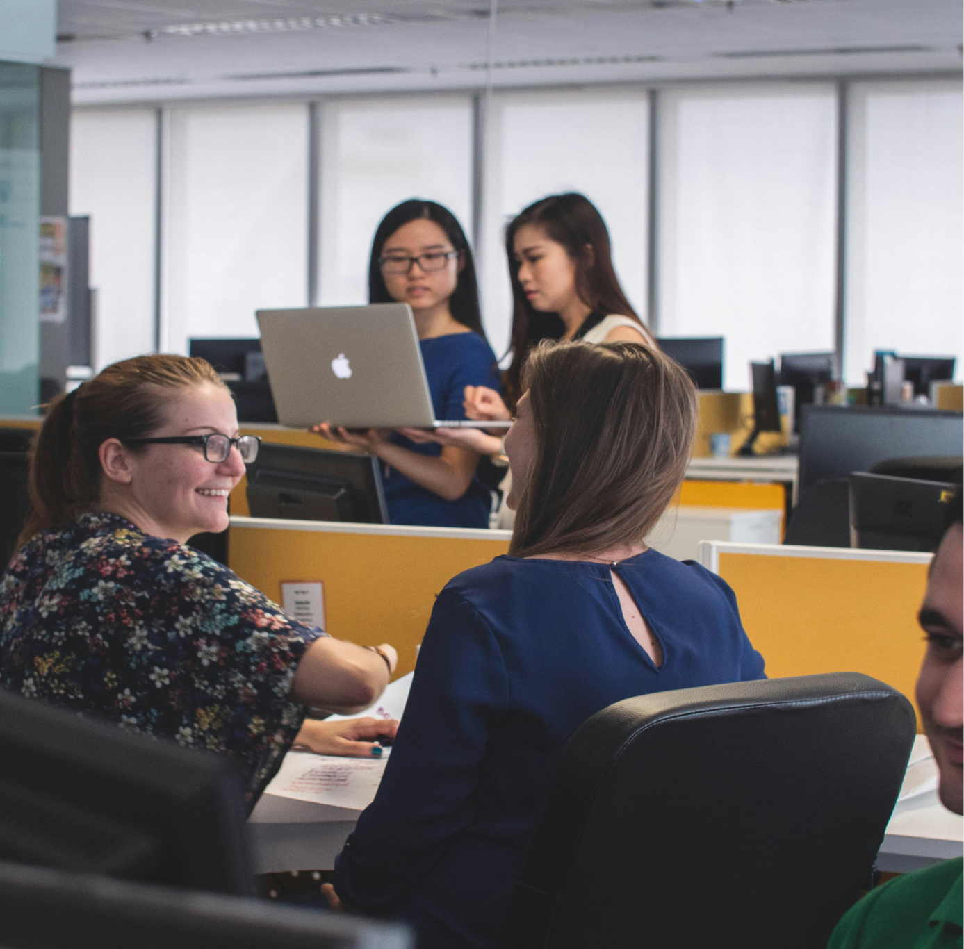 Office workers collaborating